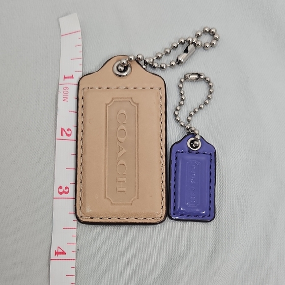 Coach Handbags - Coach Tan and Purple Hangtags